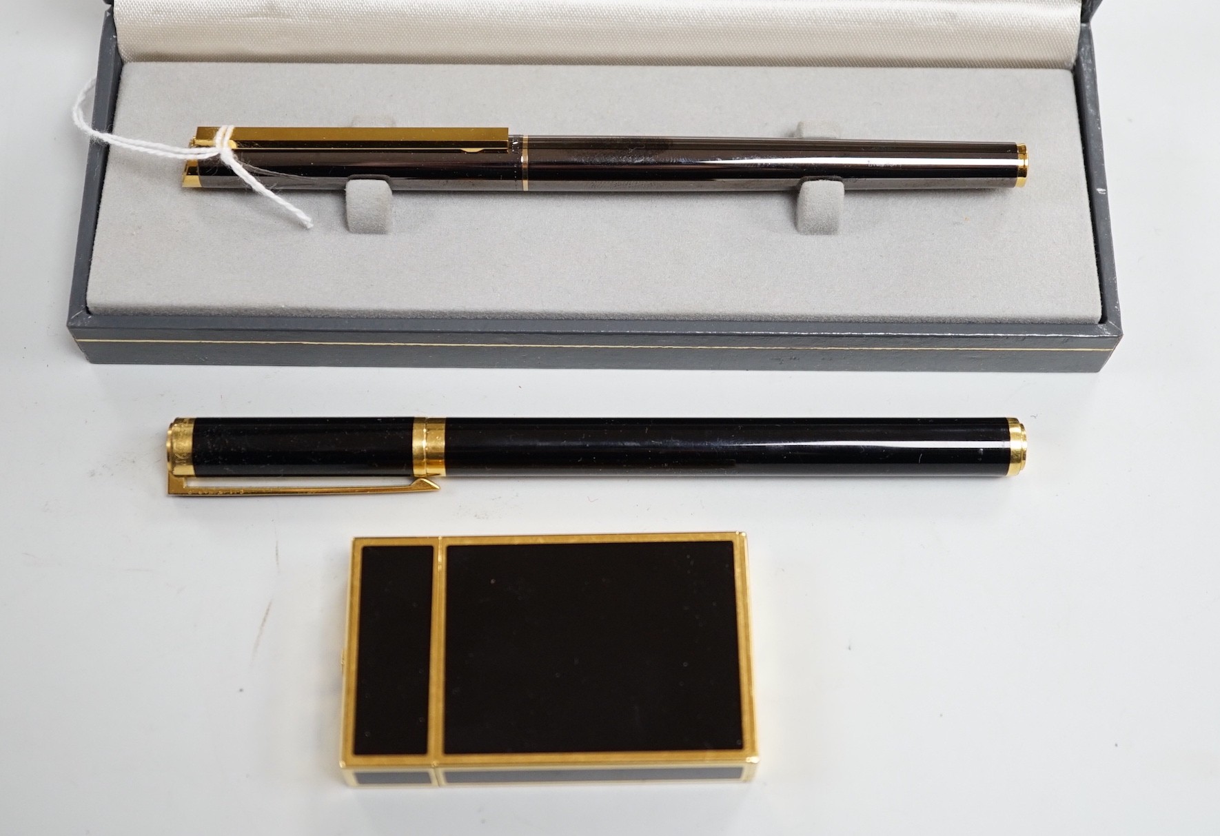 A cased Dunhill fountain pen, a Dupont travelling time piece and fountain pen